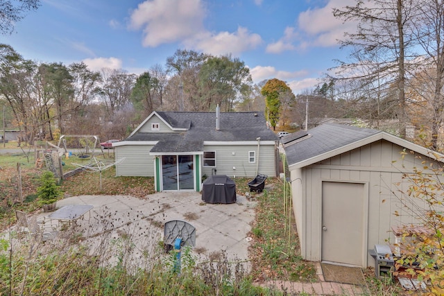 rear view of house featuring a patio area and a sunroom