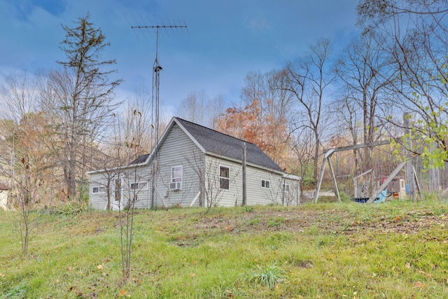 view of property exterior featuring a playground