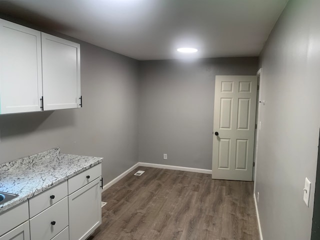 washroom with dark wood-type flooring