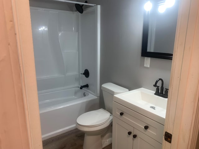 full bathroom featuring shower / bathing tub combination, toilet, vanity, and hardwood / wood-style flooring