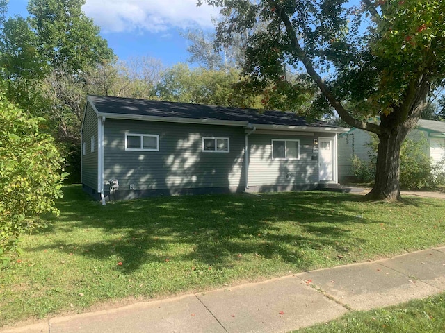 view of outbuilding with a yard