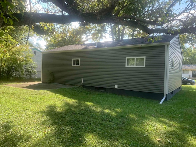 view of home's exterior with a lawn