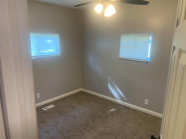 empty room with carpet flooring and ceiling fan