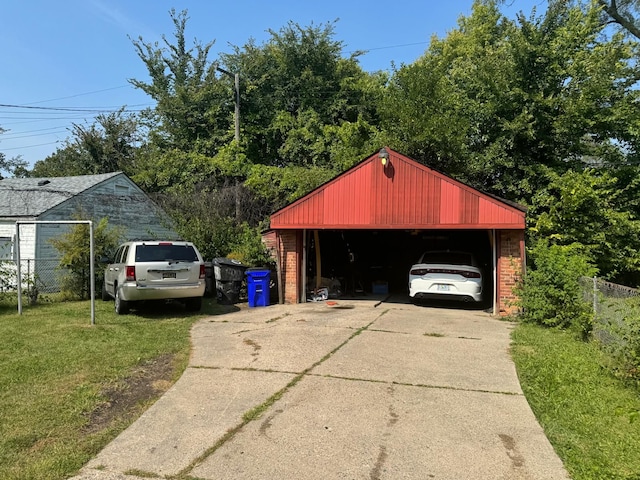 garage featuring a lawn