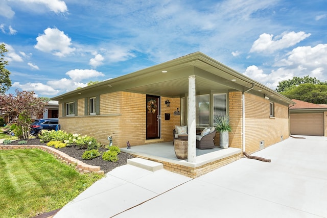 view of front facade with a porch and a garage