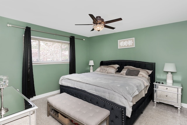 bedroom with ceiling fan and light colored carpet