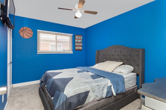 bedroom with light colored carpet and ceiling fan