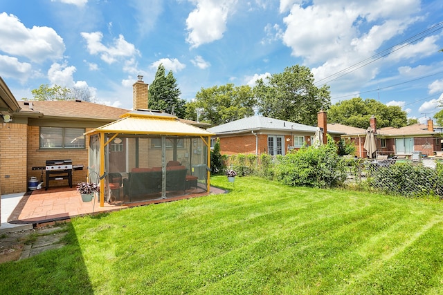 view of yard featuring a gazebo and a patio area