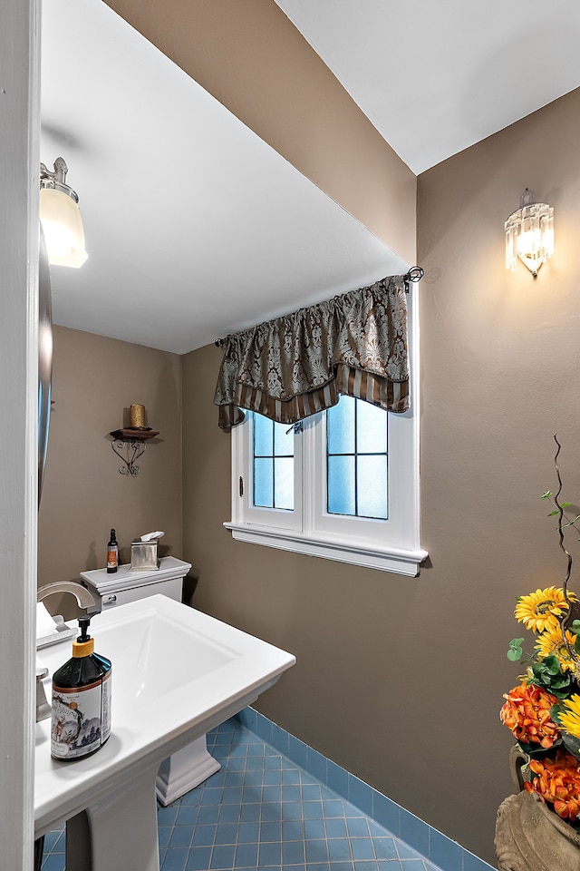 bathroom with tile patterned flooring and sink