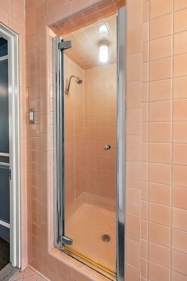 bathroom featuring an enclosed shower