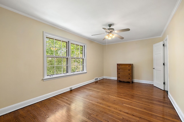 unfurnished bedroom featuring ceiling fan, dark hardwood / wood-style floors, and ornamental molding