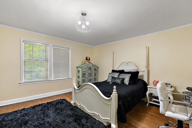 bedroom featuring crown molding and hardwood / wood-style floors