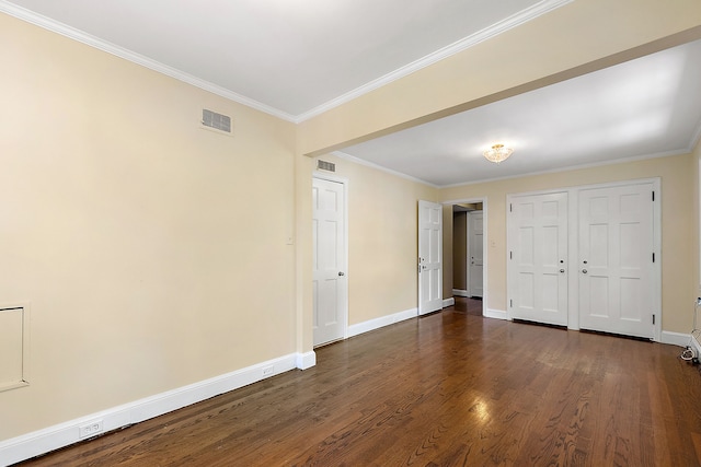 interior space with dark hardwood / wood-style flooring and ornamental molding