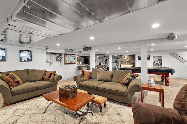 living room featuring light hardwood / wood-style flooring and billiards