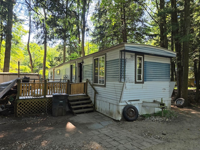 view of side of property with a deck