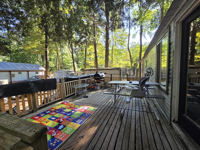 7867 W Wisconsin St, Shelby, MI 49455 - wooden deck with outdoor dining area