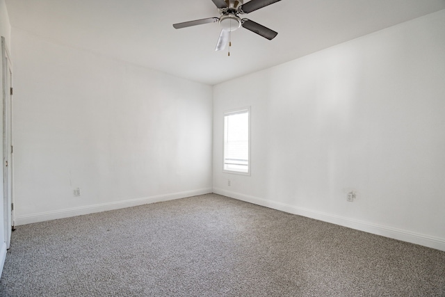 empty room featuring carpet flooring and ceiling fan