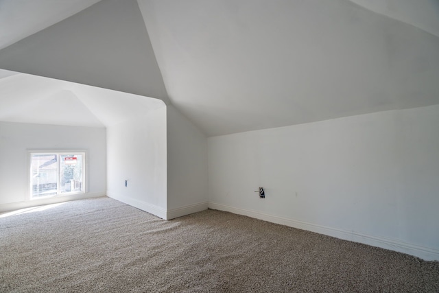 bonus room featuring carpet flooring and lofted ceiling