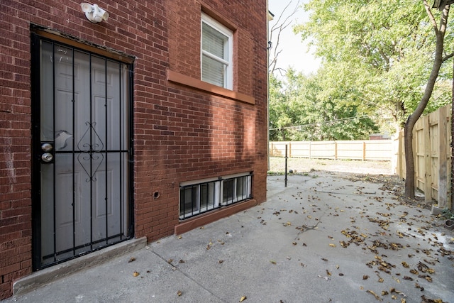 entrance to property featuring a patio area