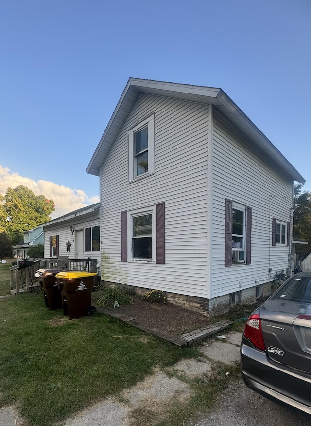 view of property exterior with a yard