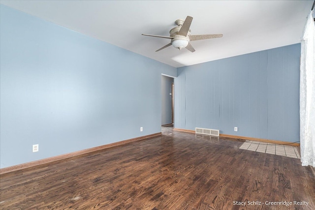 unfurnished room featuring hardwood / wood-style flooring and ceiling fan