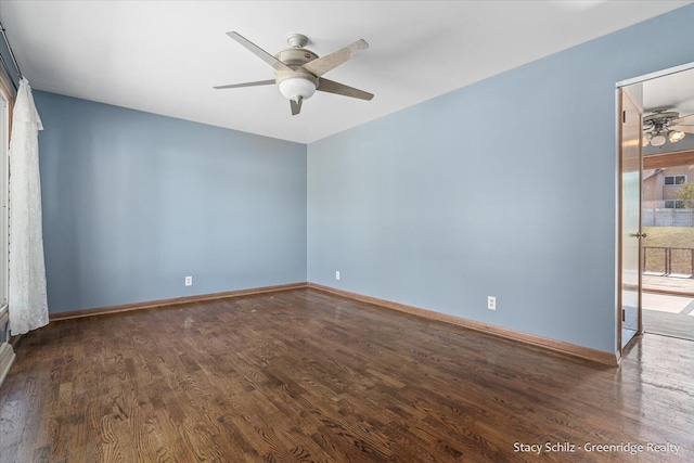 unfurnished room with ceiling fan and dark hardwood / wood-style flooring