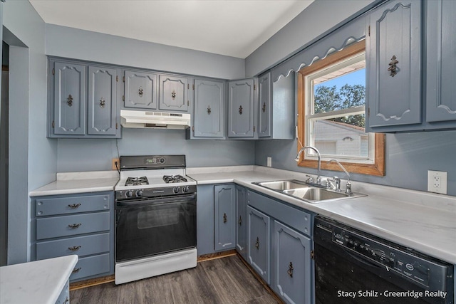 kitchen featuring white range with gas stovetop, dark wood-type flooring, dishwasher, and sink