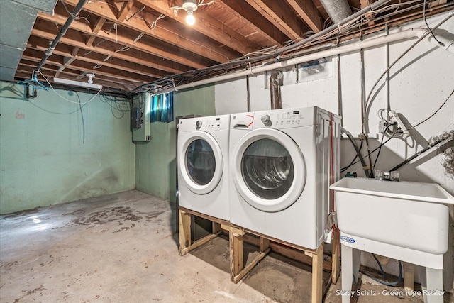 laundry area featuring sink and washer and dryer