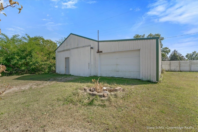 garage featuring a yard