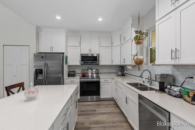8981 Spruce Ave Unit B, Newaygo, MI 49337 - kitchen featuring stainless steel appliances, a sink, white cabinetry, and recessed lighting