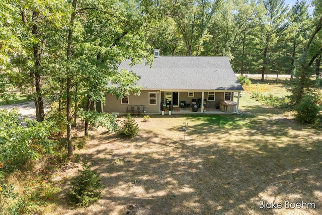 8981 Spruce Ave Unit B, Newaygo, MI 49337 - back of property featuring a patio and a shingled roof