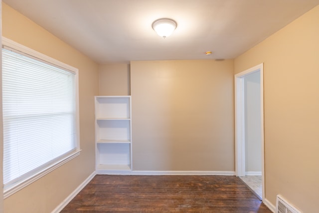 empty room featuring dark hardwood / wood-style floors