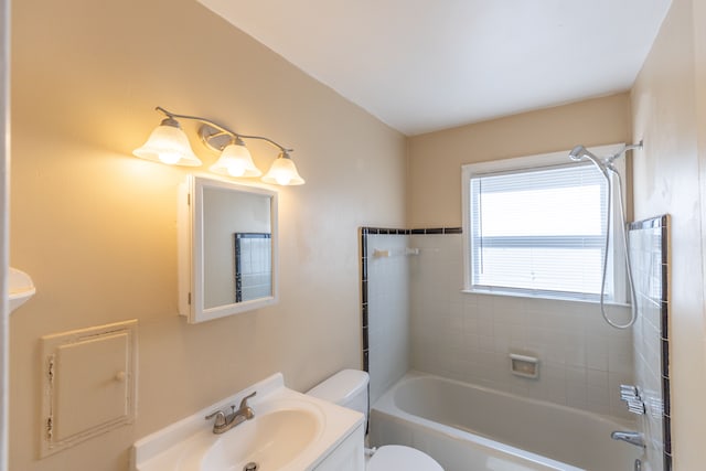 full bathroom with vanity, toilet, and tiled shower / bath