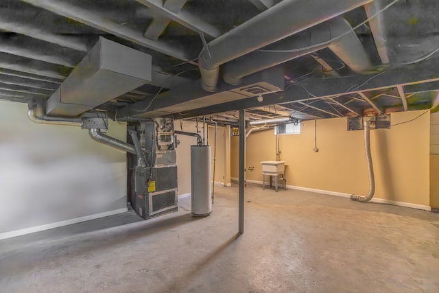 basement featuring gas water heater, sink, and heating unit