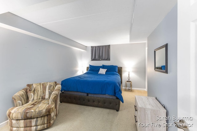 bedroom featuring light colored carpet