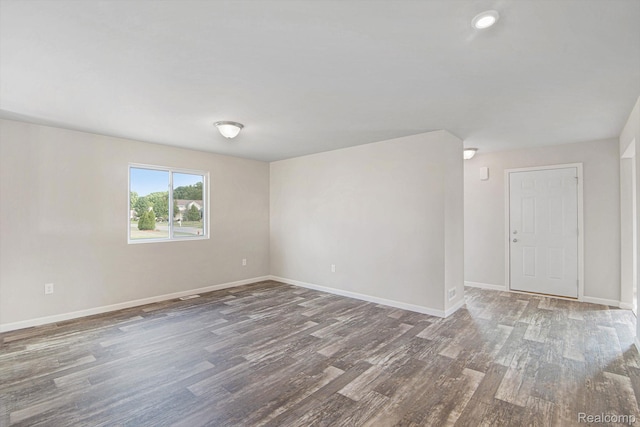 4442 Sprauge Ln, Swartz Creek, MI 48473 - spare room featuring wood finished floors and baseboards