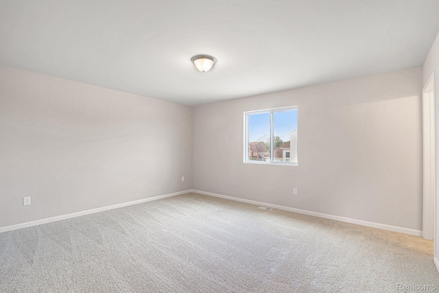 4442 Sprauge Ln, Swartz Creek, MI 48473 - unfurnished room featuring light carpet and baseboards