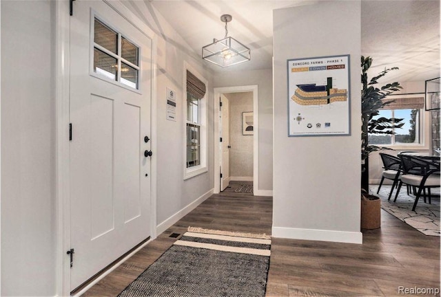 4442 Sprauge Ln, Swartz Creek, MI 48473 - entryway with baseboards and wood finished floors