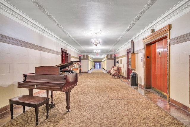 miscellaneous room with elevator, ornamental molding, and a notable chandelier