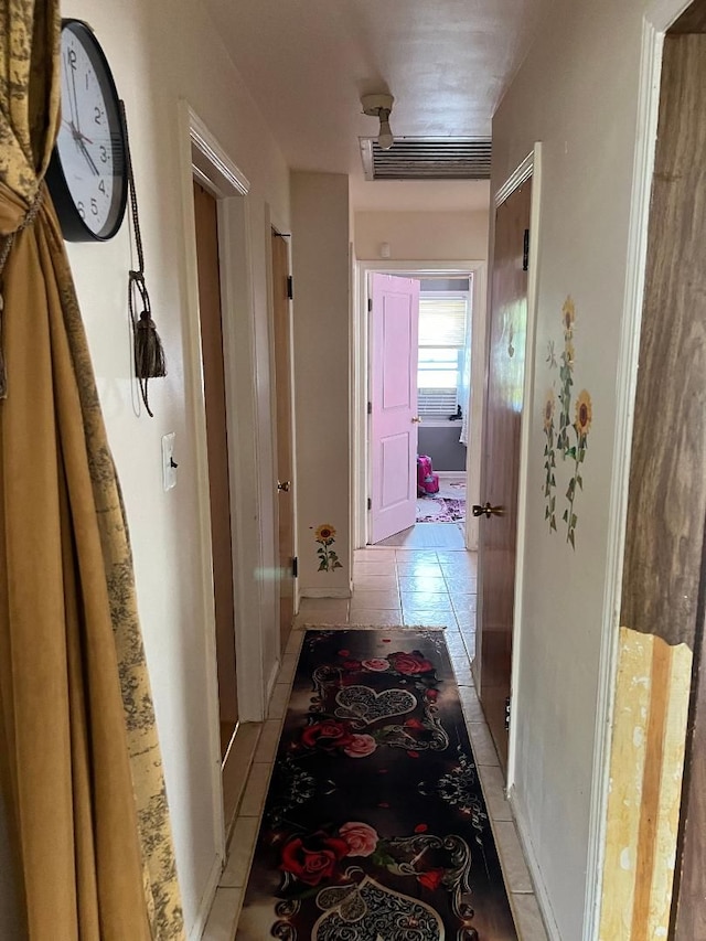 hallway with light tile patterned floors