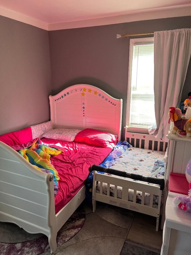 tiled bedroom with crown molding