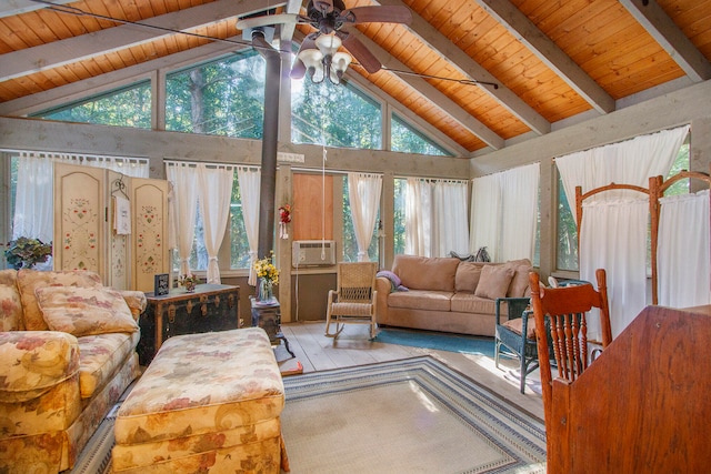 living room with light hardwood / wood-style floors, a healthy amount of sunlight, and high vaulted ceiling