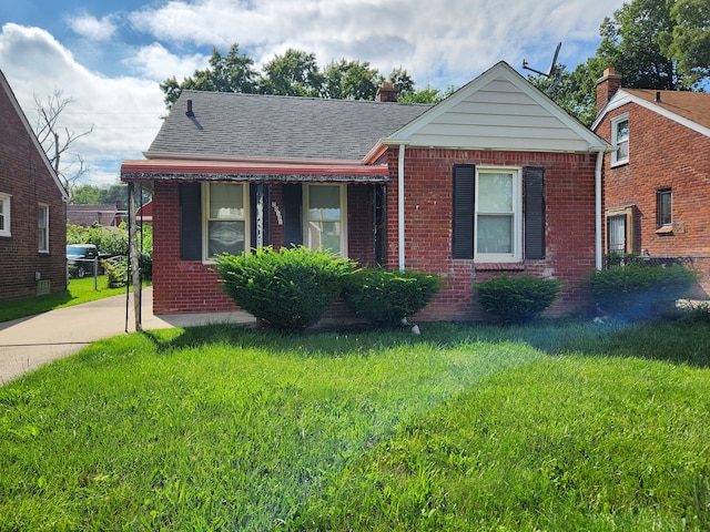 bungalow with a front yard