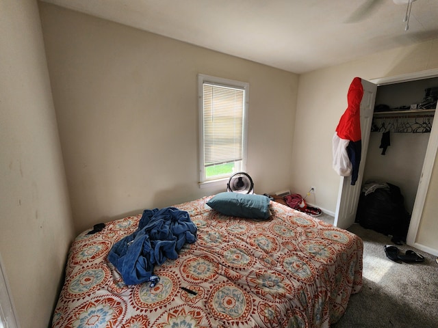 bedroom featuring carpet flooring, a closet, and ceiling fan