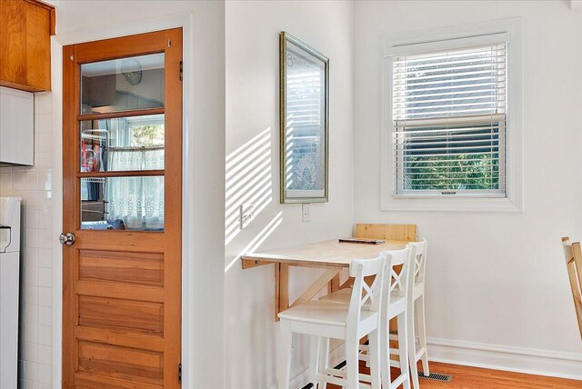 dining room featuring visible vents and baseboards