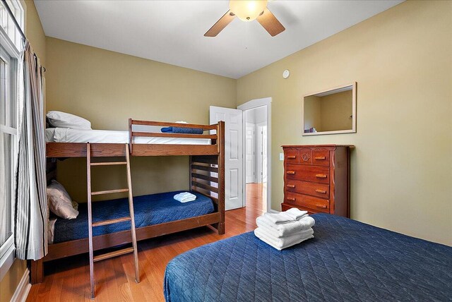 bedroom with ceiling fan and wood finished floors