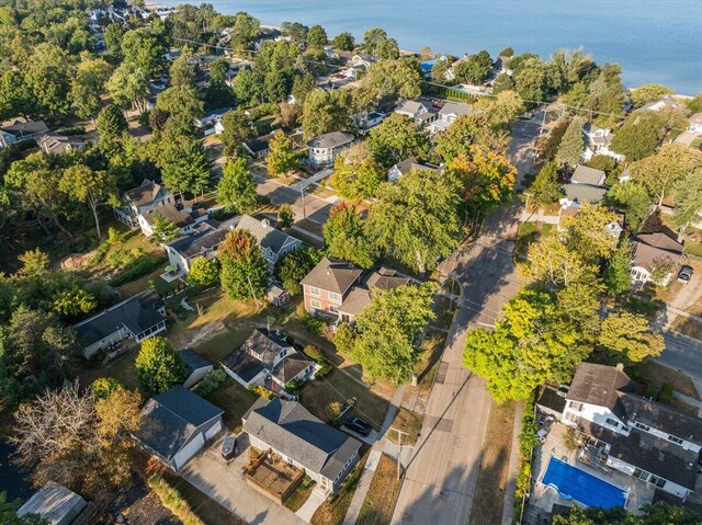 drone / aerial view featuring a water view and a residential view