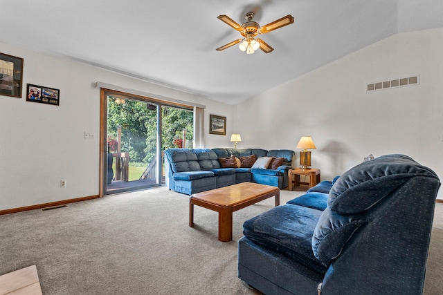 living room with carpet, ceiling fan, and vaulted ceiling