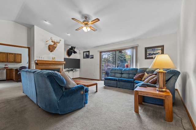 living room with ceiling fan, carpet, and lofted ceiling