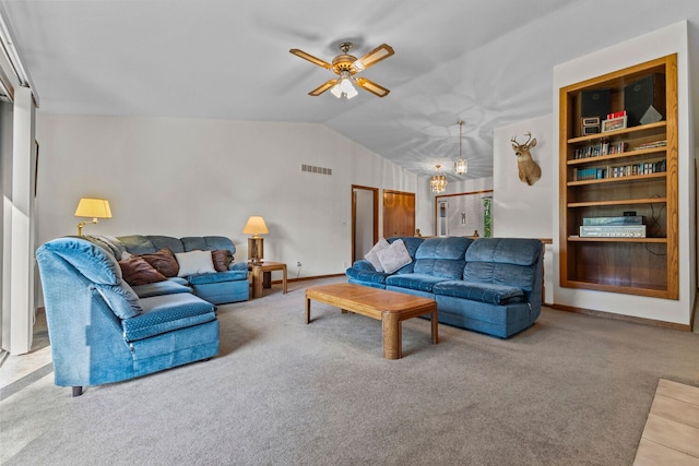 living room with ceiling fan, carpet floors, and lofted ceiling